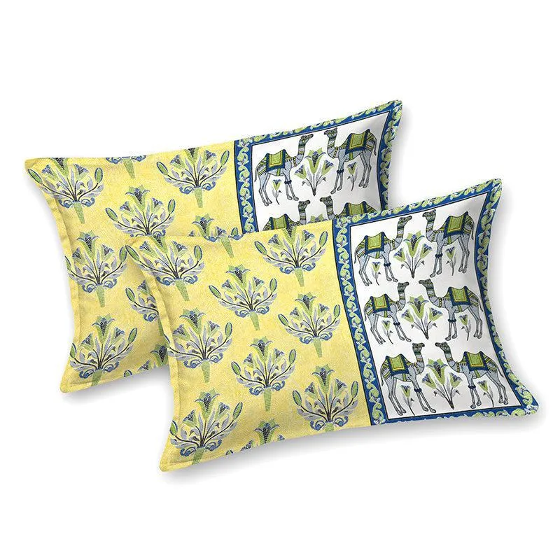 Two matching yellow pillow covers with floral and elephant print