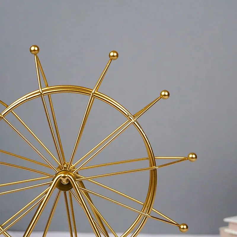 Close-up of the upper section of the gold Ferris wheel showpiece