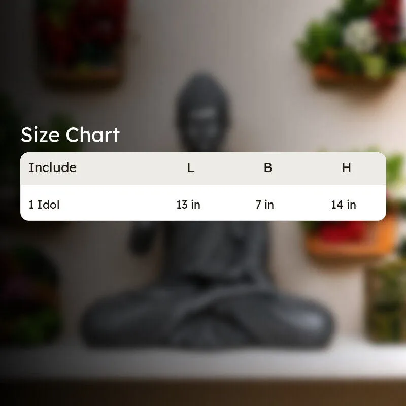 Grey Buddha idol shown in a styled living space with surrounding plants
