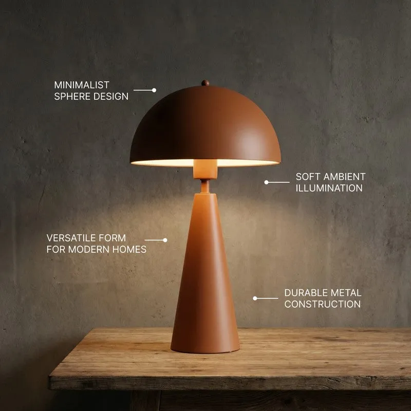 Brown table lamp placed on a wooden surface against a dark textured wall