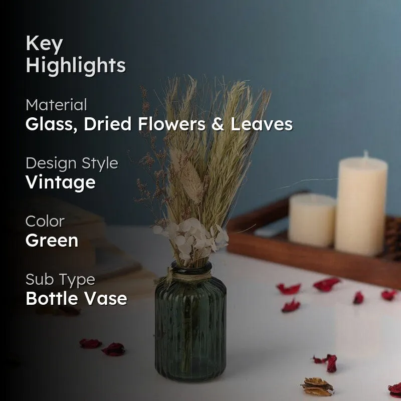 Green bottle vase with dried flowers and text overlay