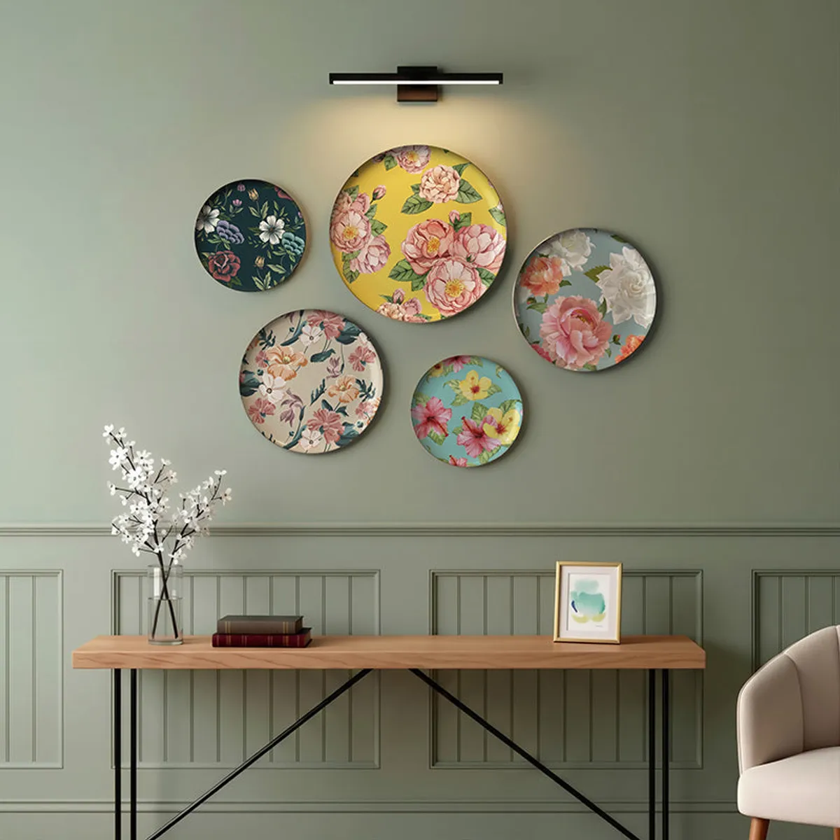 Five round floral wall plates arranged on a green living-room wall
