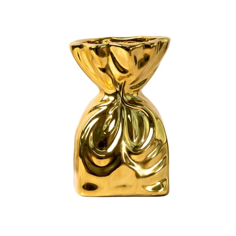Front view of a glossy gold sculptural ceramic vase on a white background