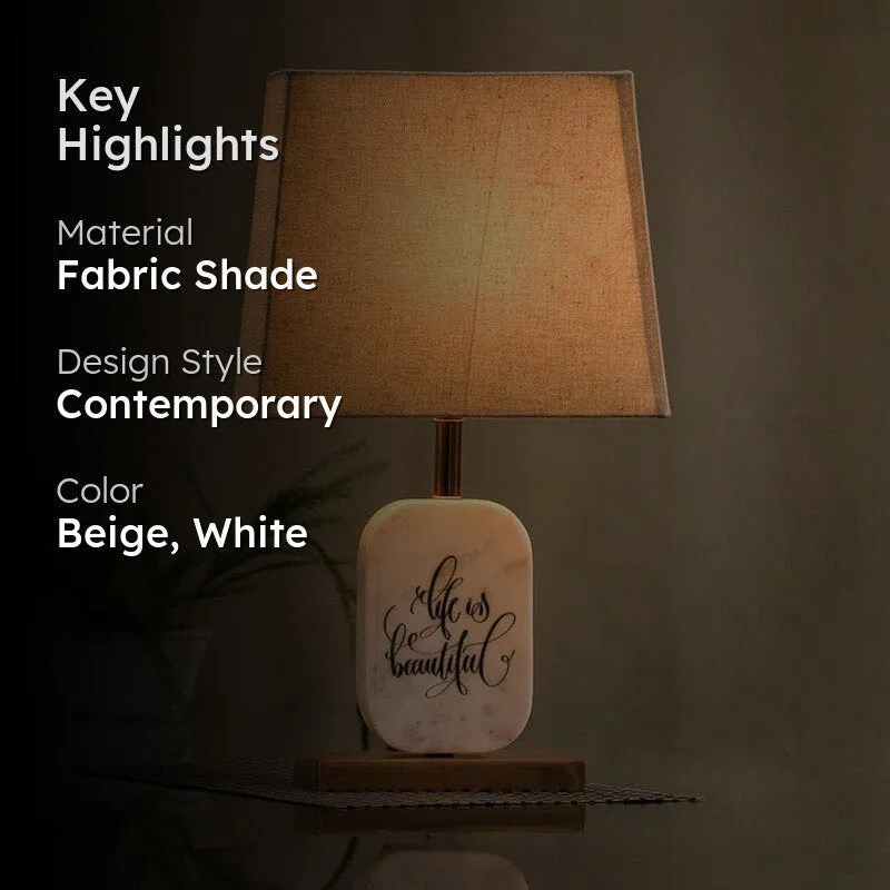 Table lamp with beige shade and marble base shown with key highlights overlay