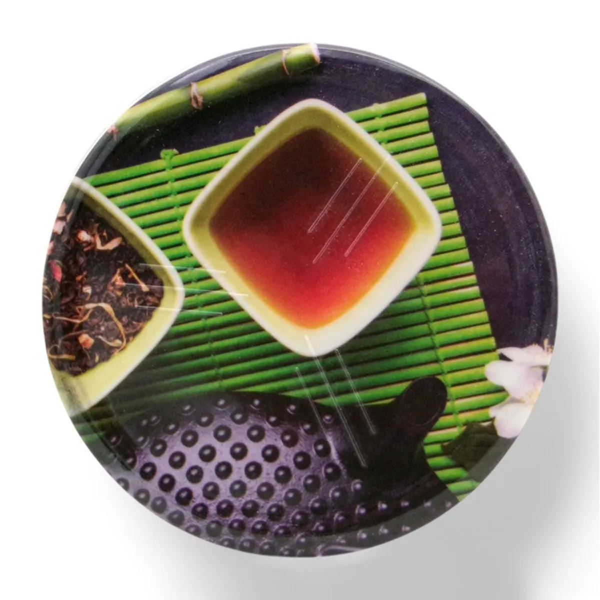 Single round coaster with a multicolour tea-inspired motif on a white background