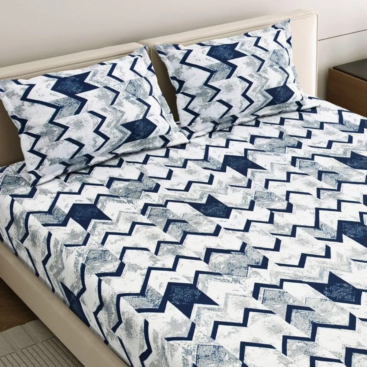 Close view of abstract blue and white patterned bedsheet