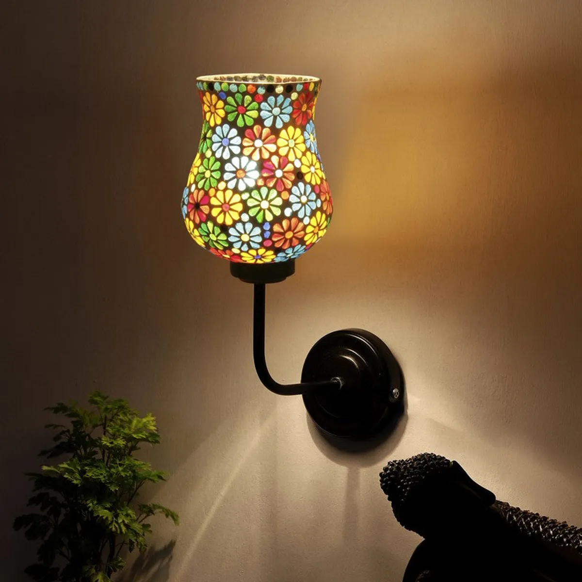 Glowing multicolour mosaic wall lamp casting warm light