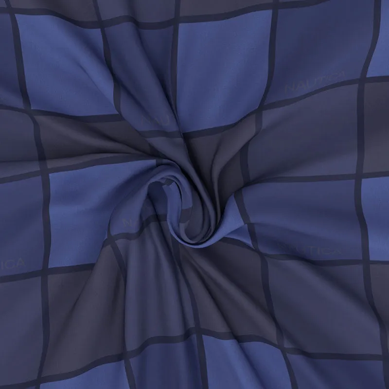 Blue printed cotton bedsheet draped to show its soft fabric