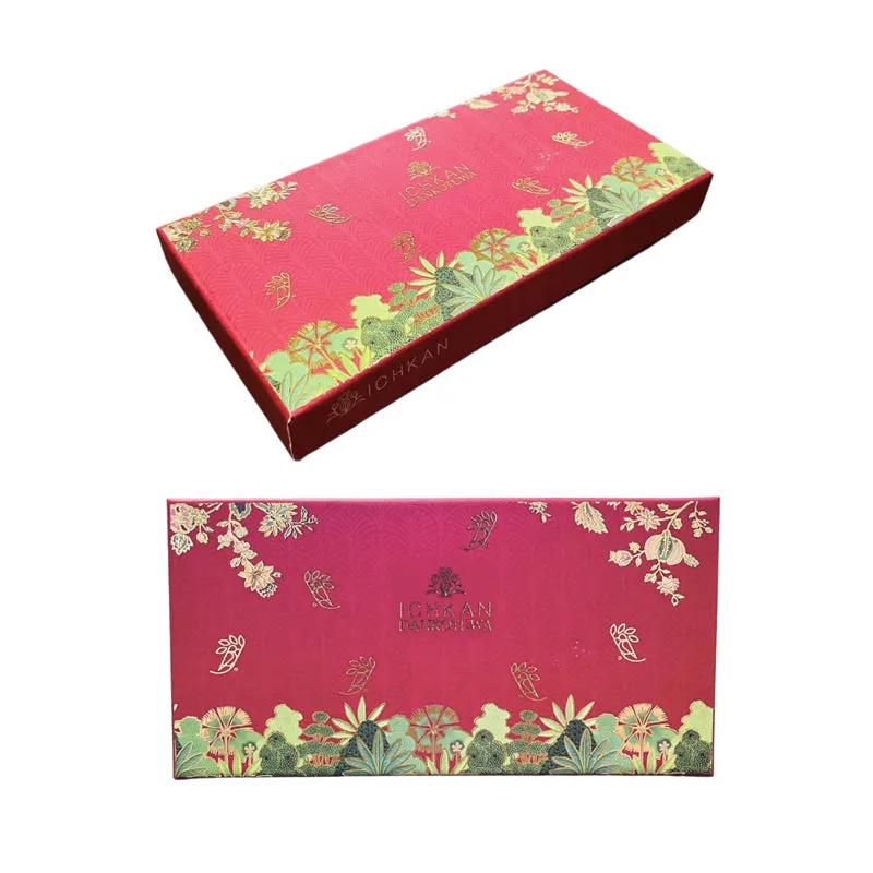 Decorative red product box with gold floral artwork