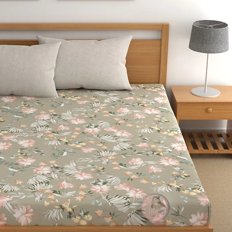 Angled view of floral fitted bedsheet on a wooden bed