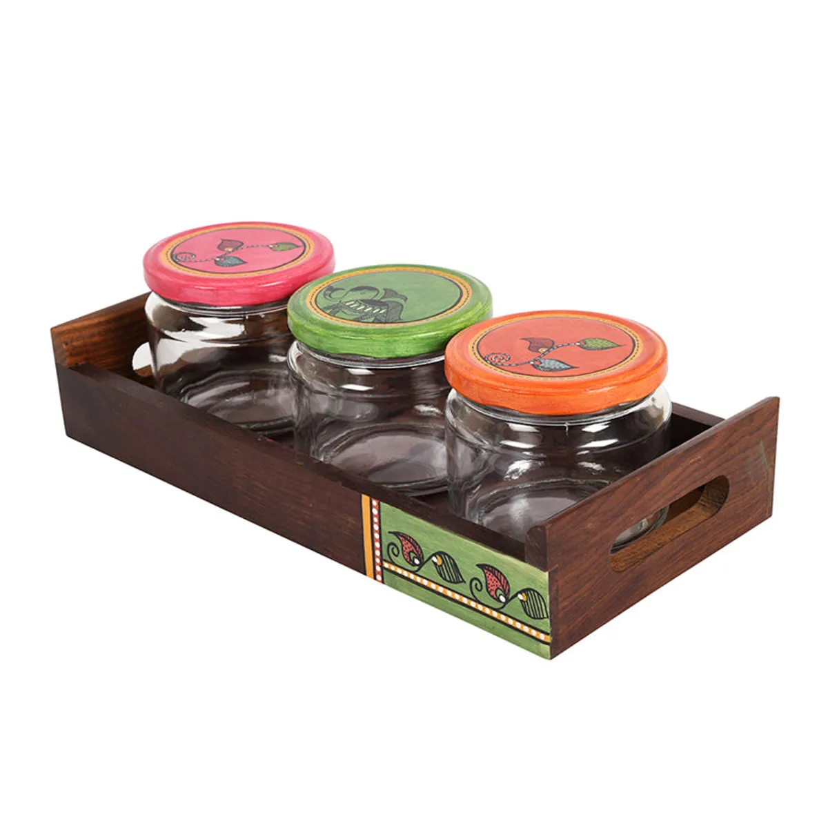 Angled view of three colourful-lidded jars in a decorated wooden tray