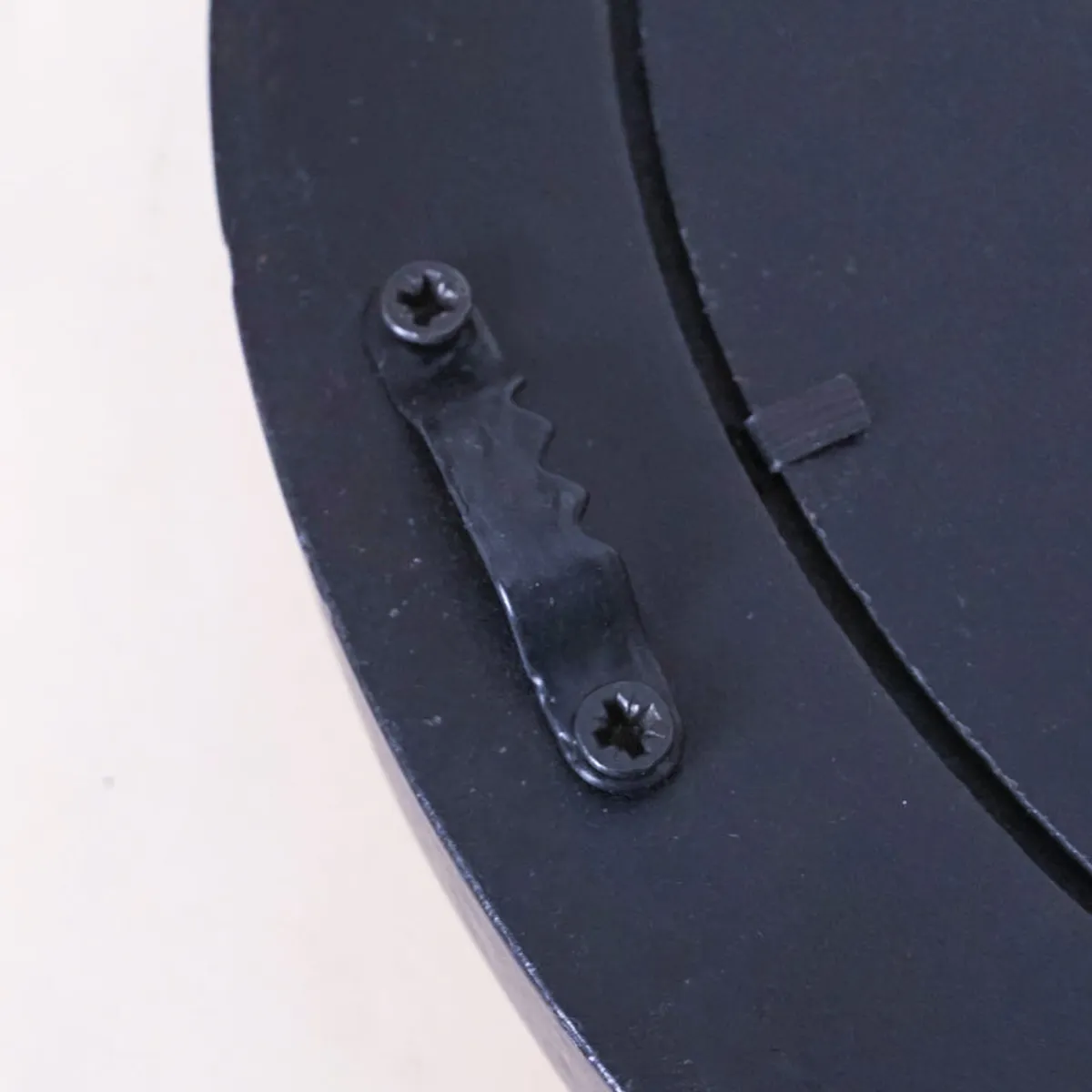 Close-up of the wall clock's rear hanging bracket