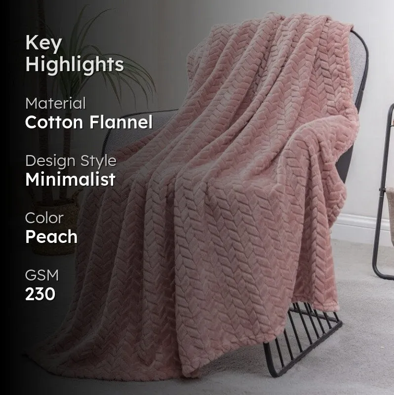 Peach chevron blanket shown on a lounge chair