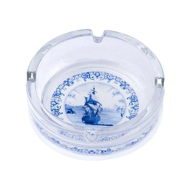 Clear glass ashtray with blue ship motif and notched rim