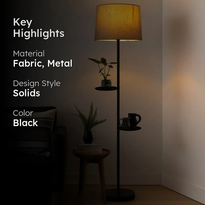 Warmly lit floor lamp with shelves in a darkened living room setting