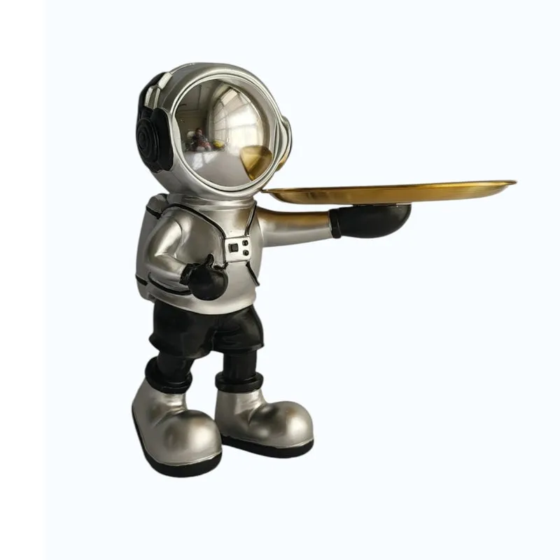 Close three-quarter view of the silver astronaut accent tray