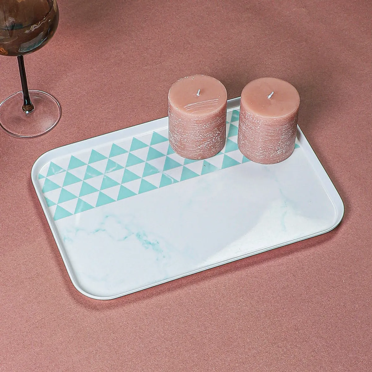 Blue-and-white serving tray styled with two candles