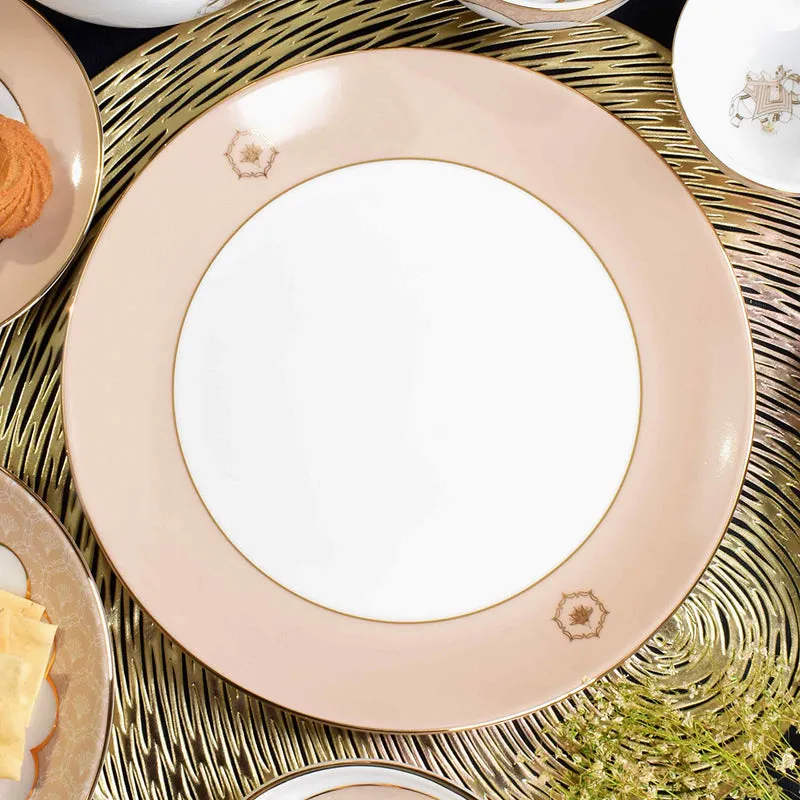 Large peach porcelain plate with ivory centre and fine gold edging