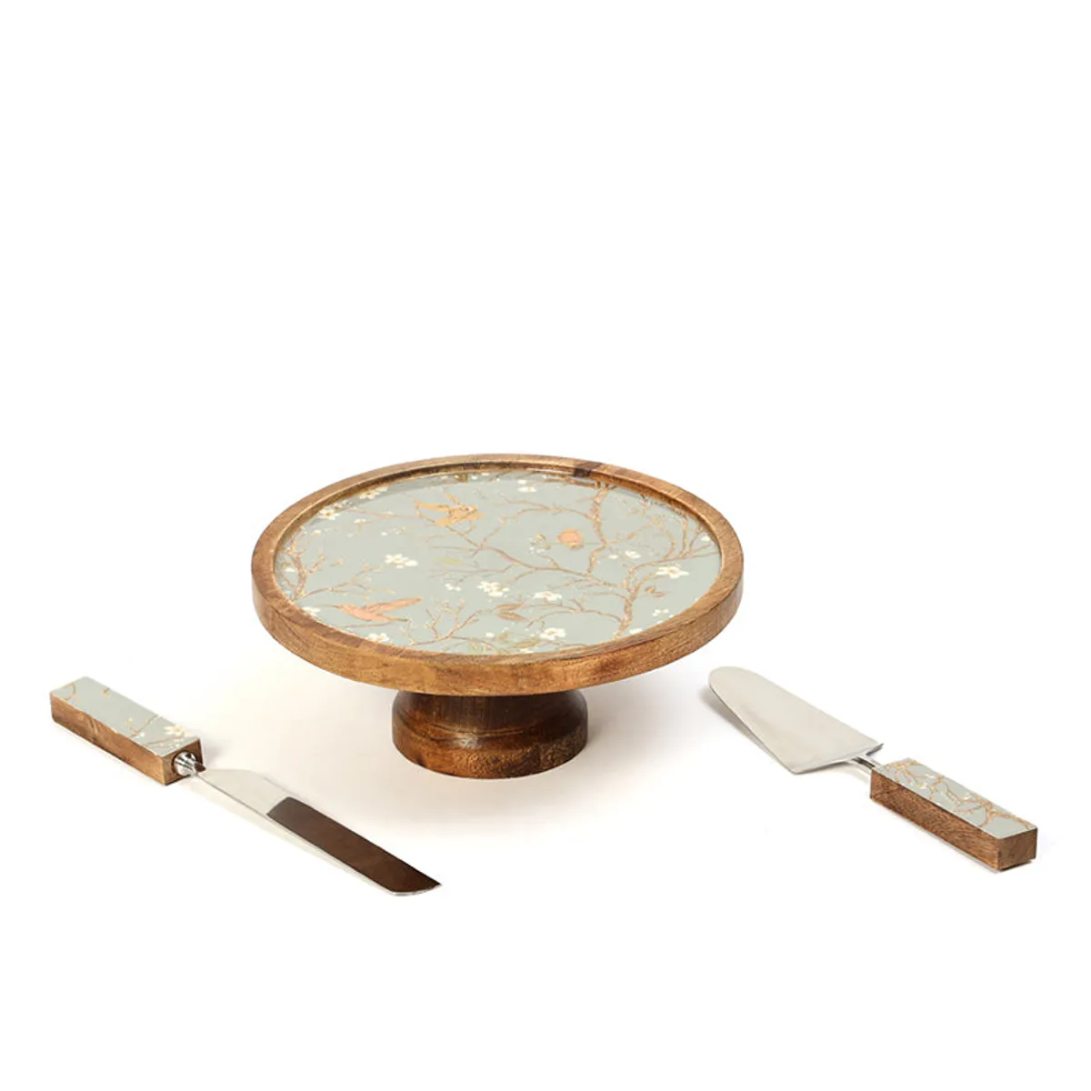 Cake stand with knife and server displayed beside it