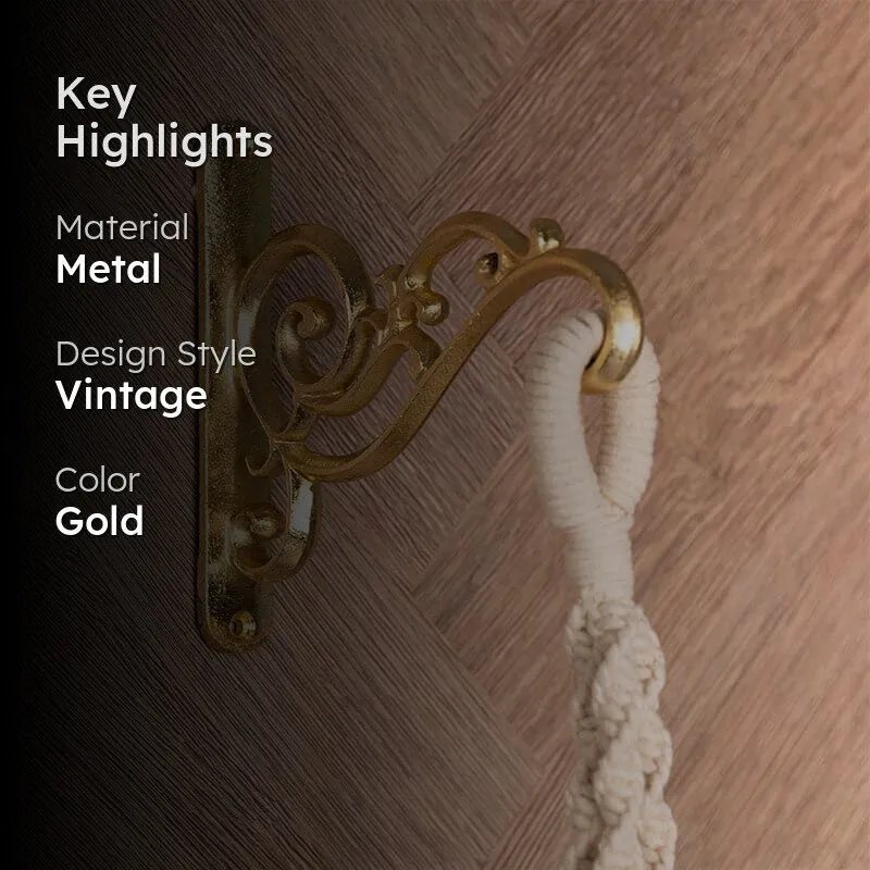 Gold wall bracket styled on a wood-toned wall with a hanging textile