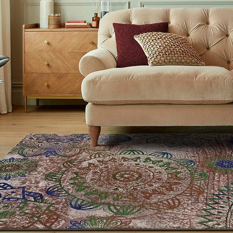 Close view of the carpet beside a beige sofa showing large circular motifs