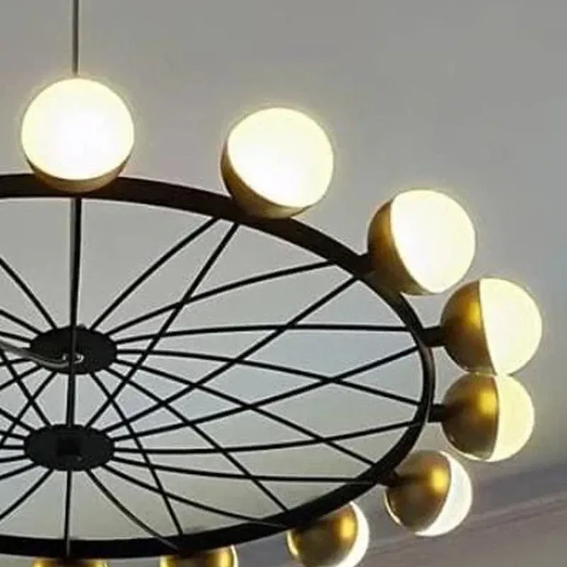 Close-up of the chandelier's circular frame and spherical light shades.