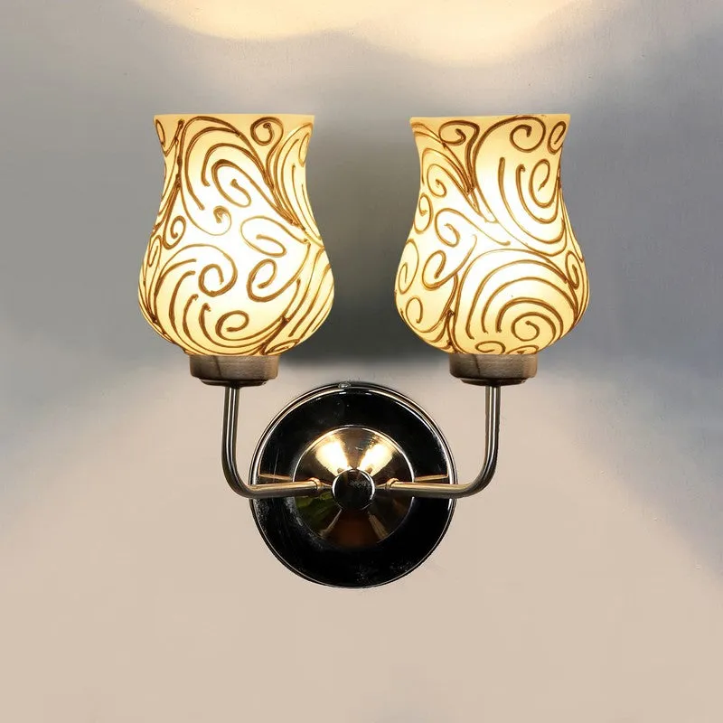 Lit front view of white and gold dual glass wall lamp