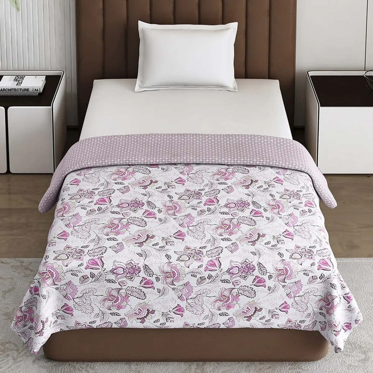 Pink floral dohar styled neatly on a contemporary bed