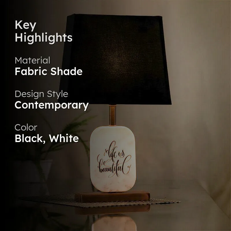 Black and white contemporary table lamp with typography on marble base