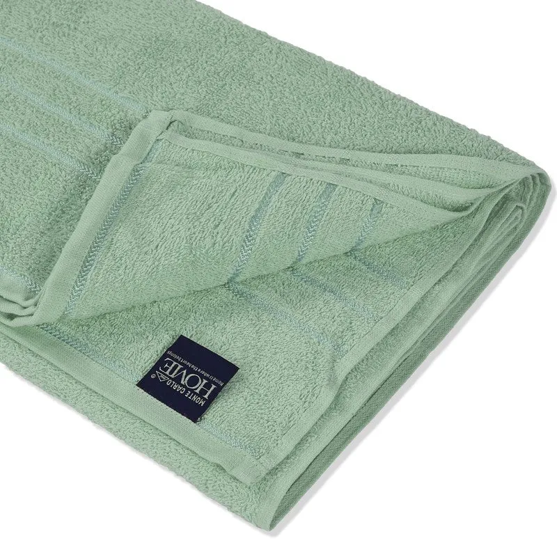 Close-up of folded sage green cotton bath towel