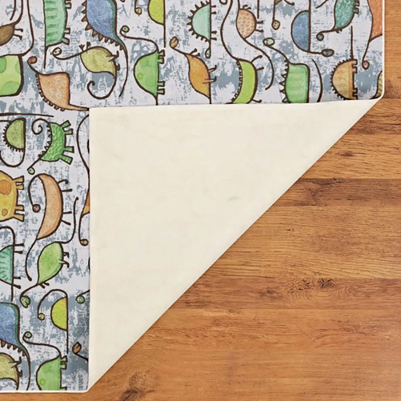 Corner of rectangular dinosaur print carpet with underside visible