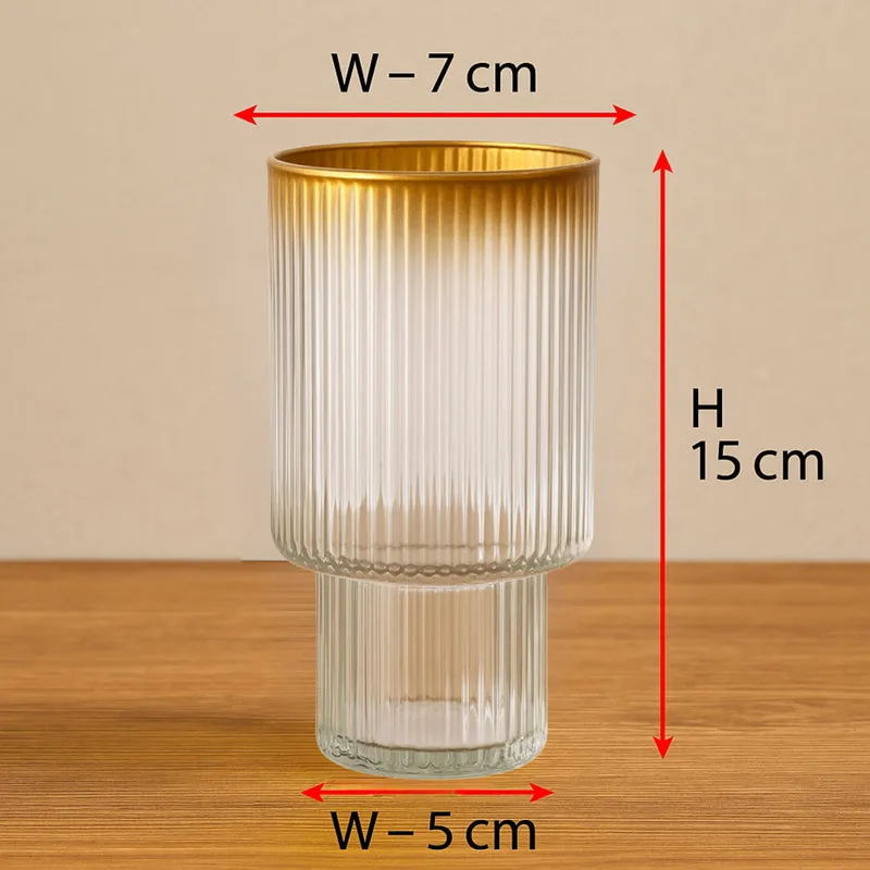 Front view of the ribbed glass vase on a wooden surface