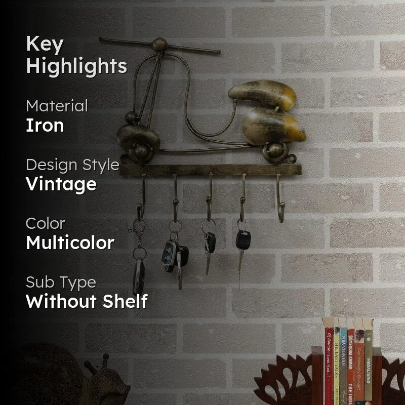 Scooty Ride key holder shown mounted on a wall with visible product highlights