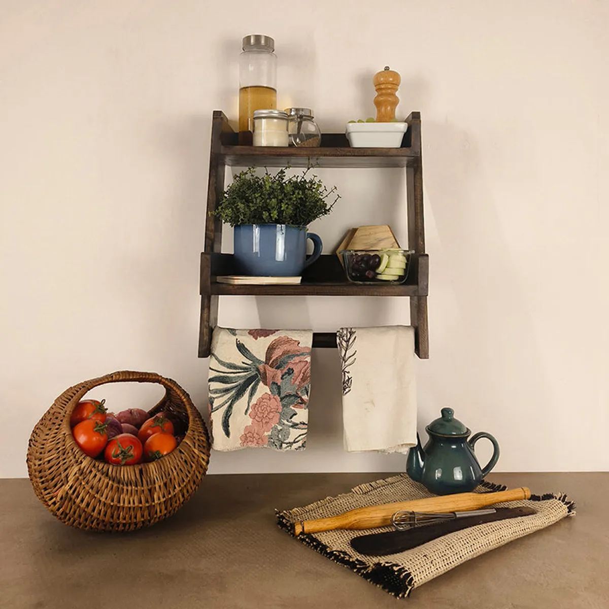 Rustic brown wooden wall shelf with two tiers and hanging kitchen towels