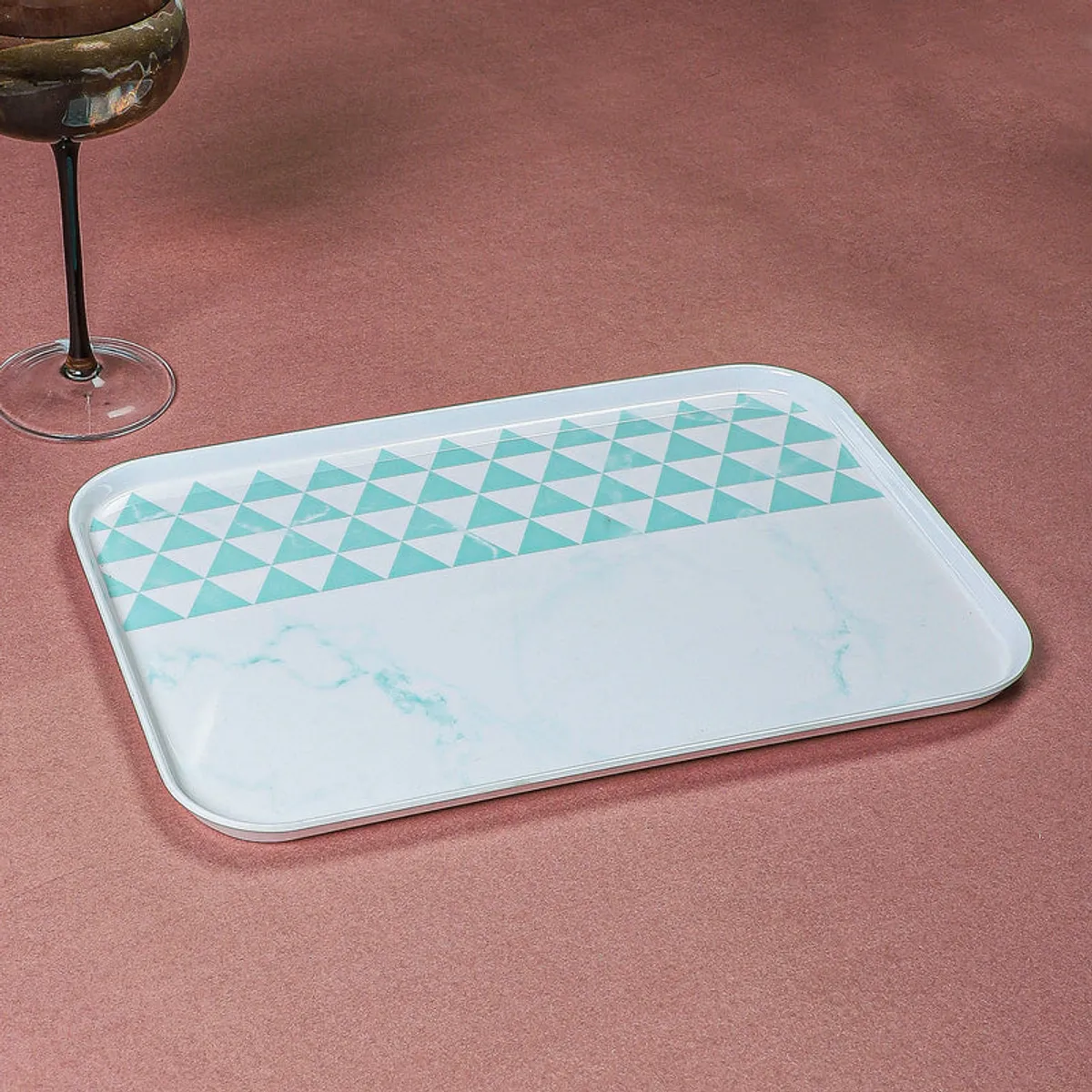 Rectangular serving tray featuring a blue triangle pattern on white