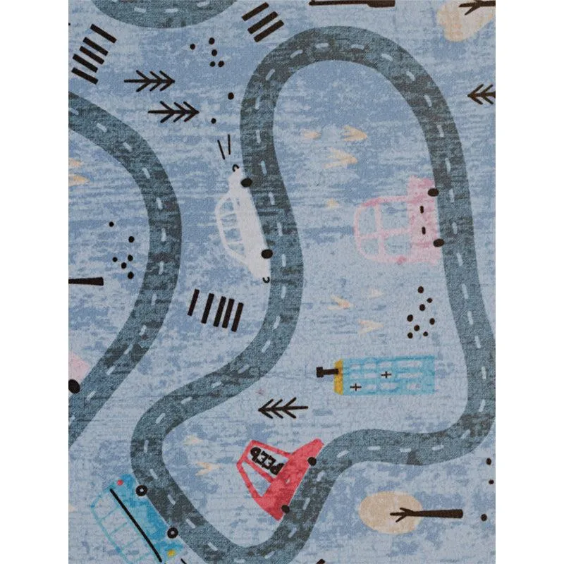 Close-up of blue carpet with winding roads, cars and building motifs
