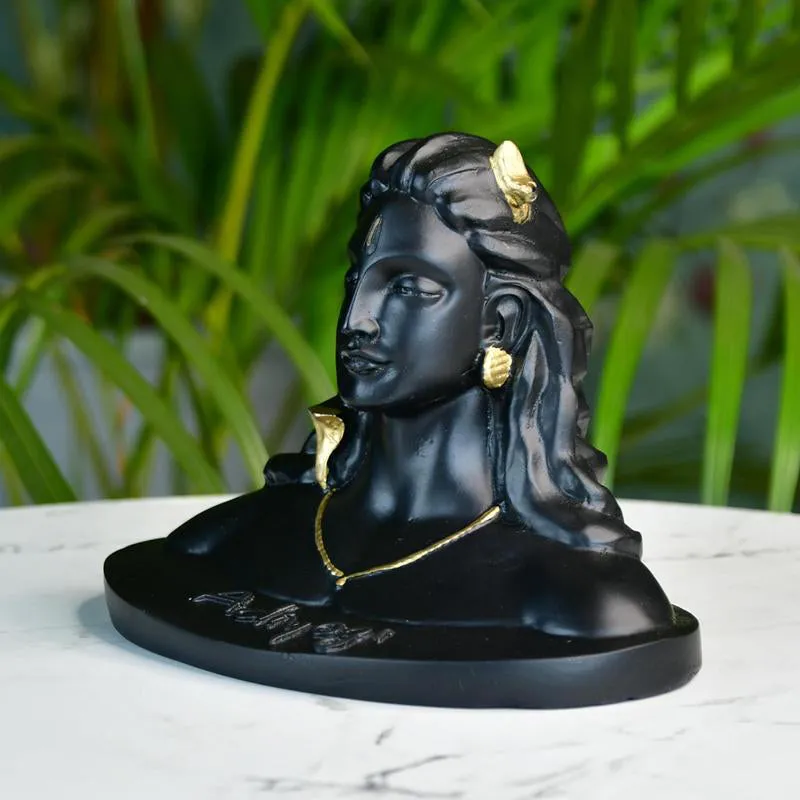 Three-quarter view of the black Adiyogi showpiece on a tabletop