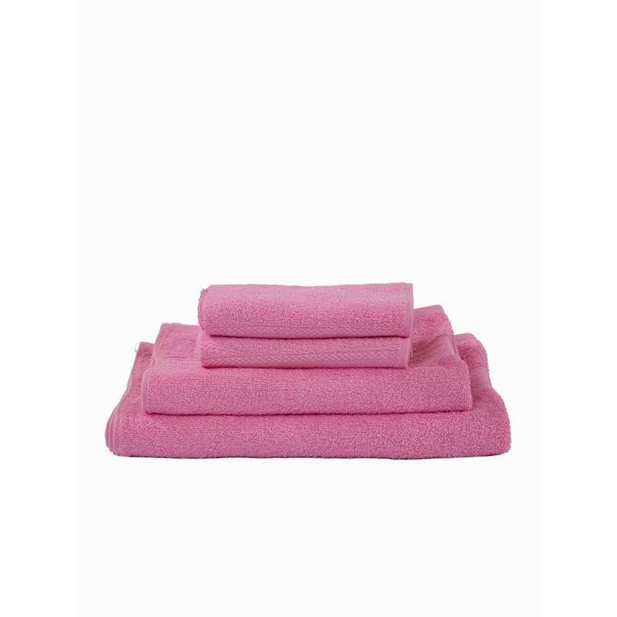 Pink towels folded in a neat stack on a white background