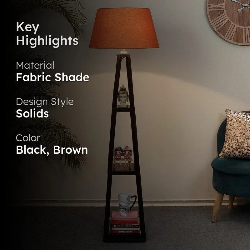 Floor lamp with orange shade and dark wood frame in a room setting