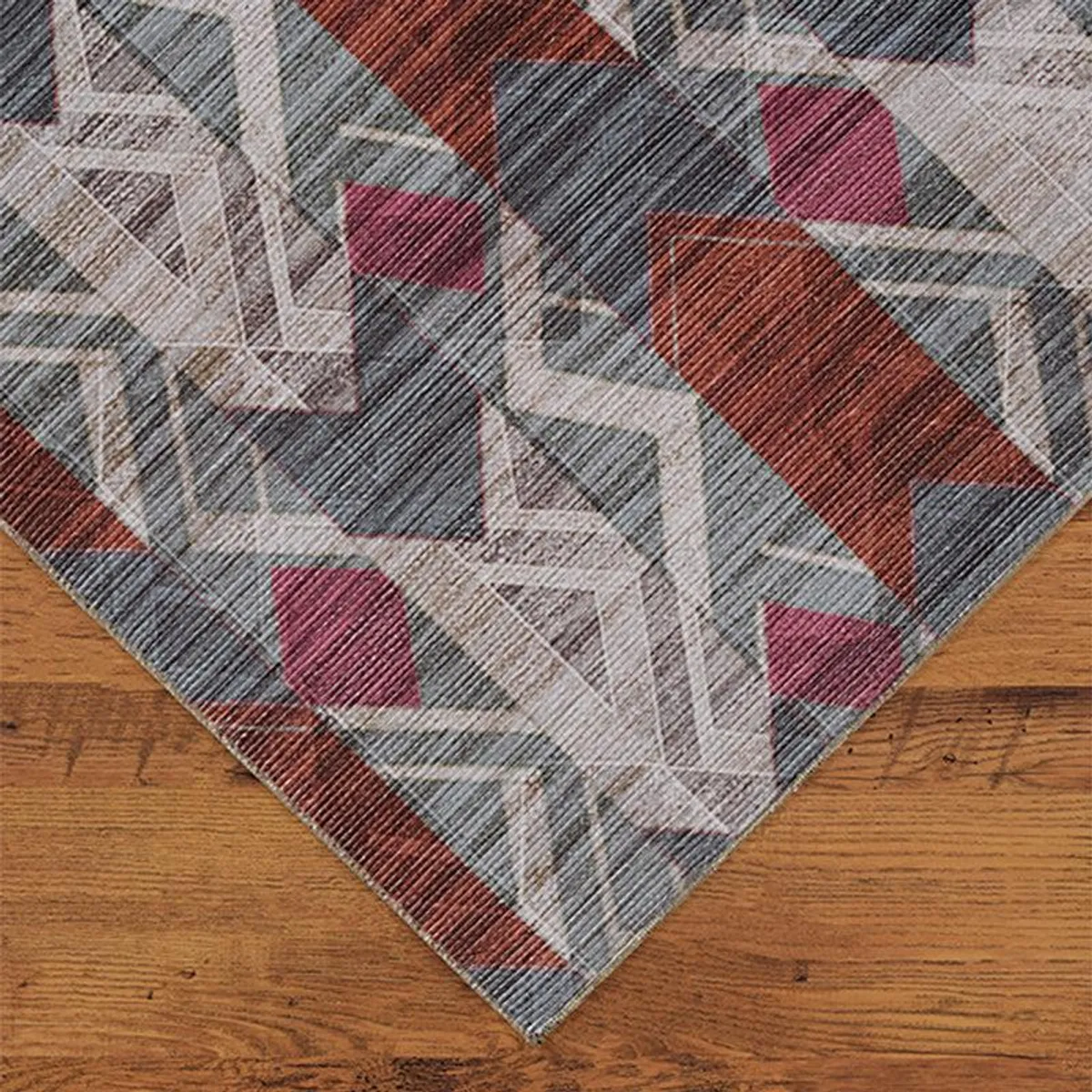 Corner view of the geometric carpet on a wooden floor