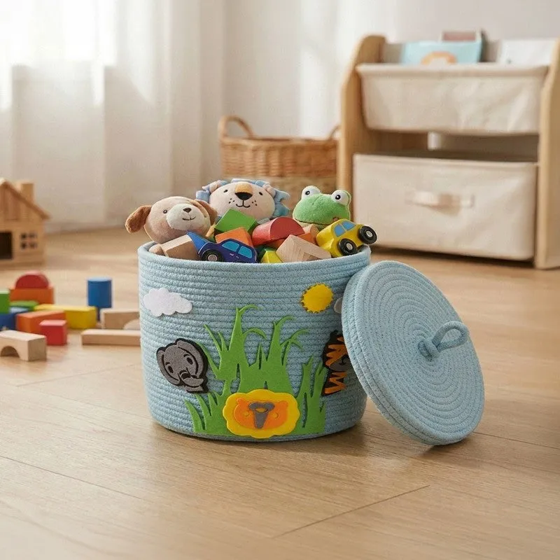 Blue round storage basket with lid and jungle animal appliqué, filled with toys