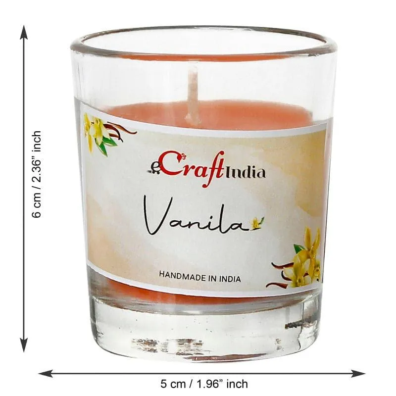 Single orange votive candle in a clear cylindrical glass holder