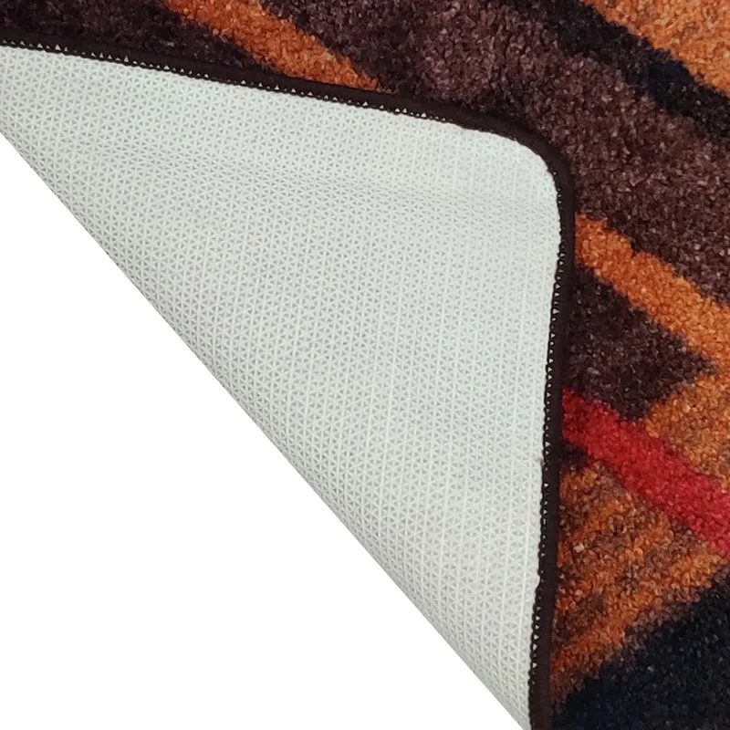 Corner of the runner rug showing the underside and bound edge