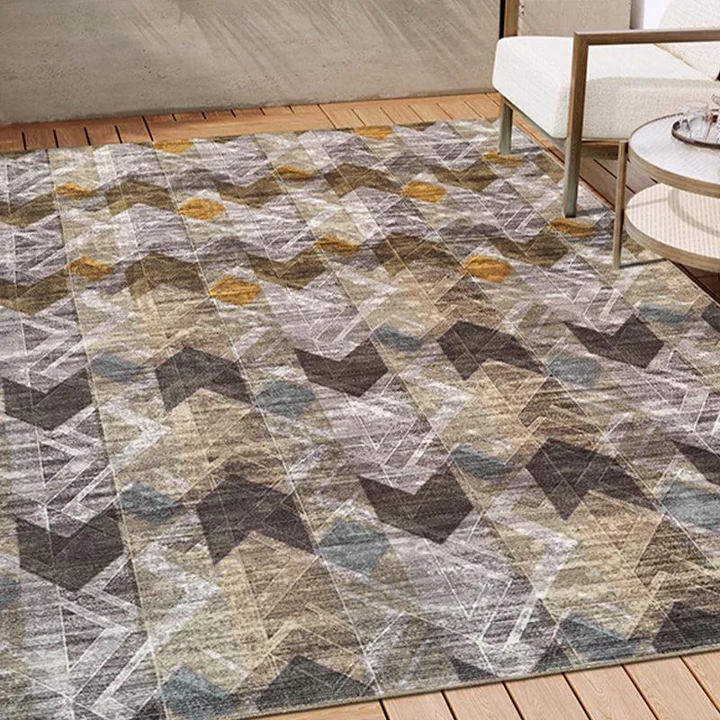 Brown and grey geometric carpet placed in a living room setting