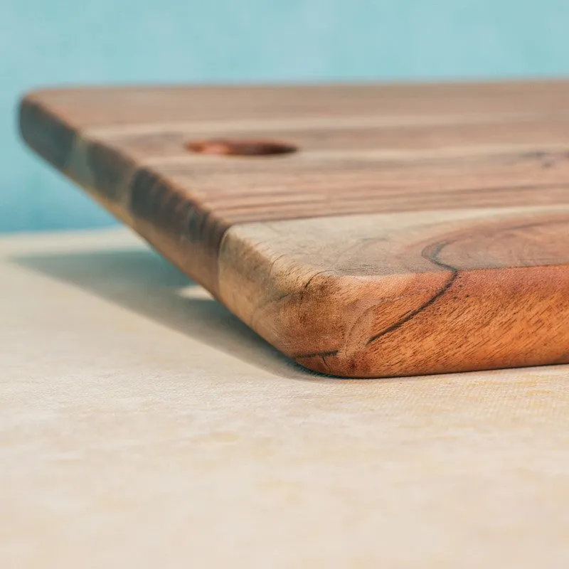 Close-up view of the board's rounded wooden edge and grain