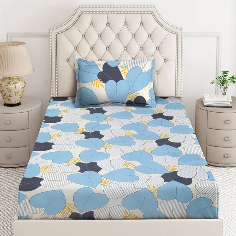 Front view of blue floral bedsheet with matching pillow cover on a bed