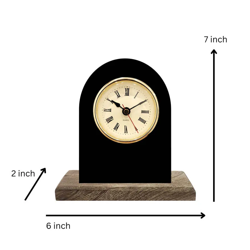 Black table clock on wood base with dimensions shown in the image