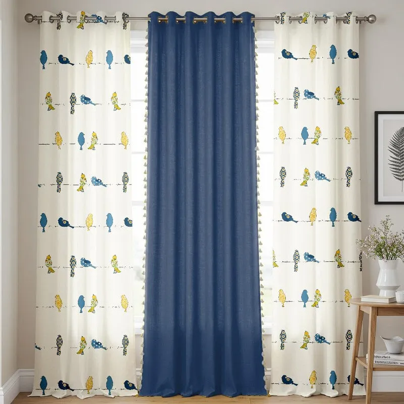 Humming Bird Blue room-darkening curtains hanging on a curtain rod in a room
