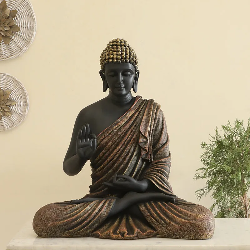 Front-facing Buddha idol styled on a console with decorative accents.