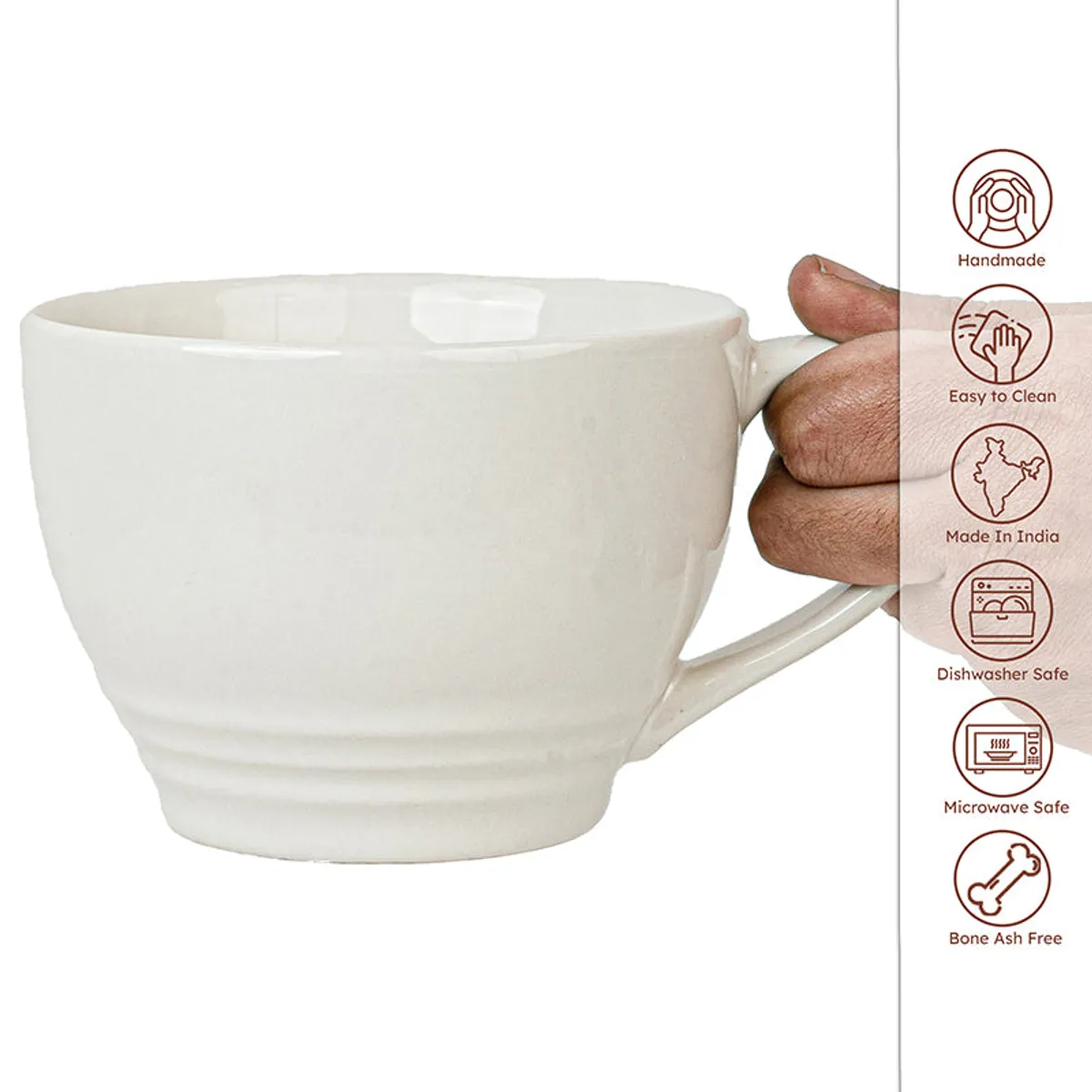 Close-up of a white ceramic mug with a curved handle